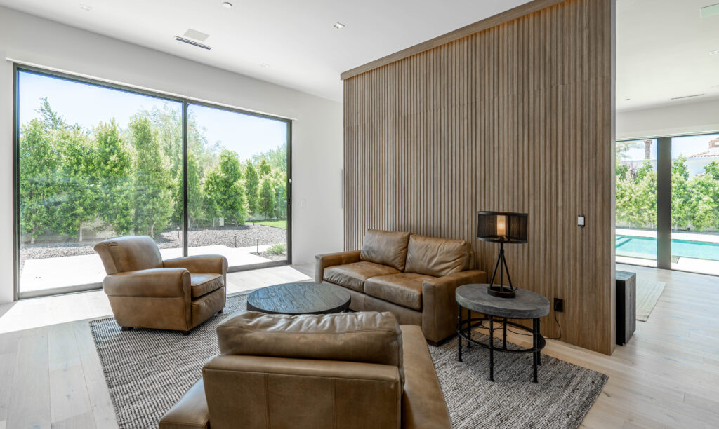 Leather living room with pool view.